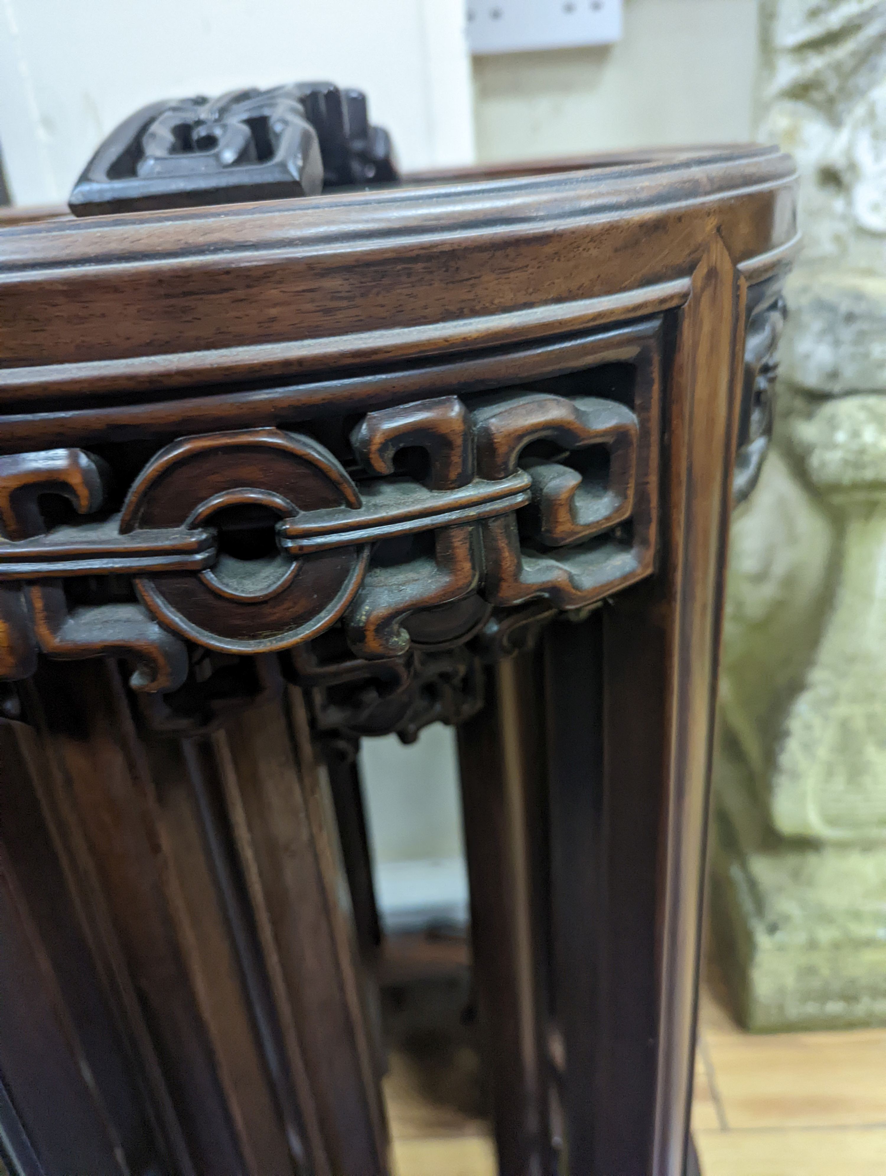 A nest of four Chinese hardwood circular tables, largest diameter 40cm, height 67cm